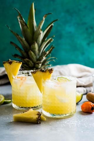 This pineapple margarita is made with sweet pineapple juice and a fresh habanero pepper for a spicy twist on a refreshing cocktail! Perfect for Cinco de Mayo!
