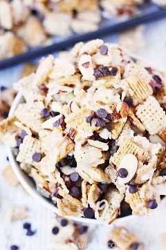 Coconut Almond Chex Mix with Grahams and Chocolate -- Coconut almond Chex mix becomes twice as irresistible after adding Golden Grahams and mini semisweet chocolate chips to the classic recipe.