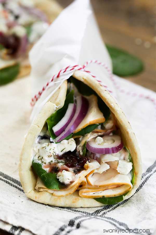 Greek Chicken Gyros - Easy Greek Gyros made with an array of fresh Greek flavors wrapped in pita bread with Tzatziki Sauce.