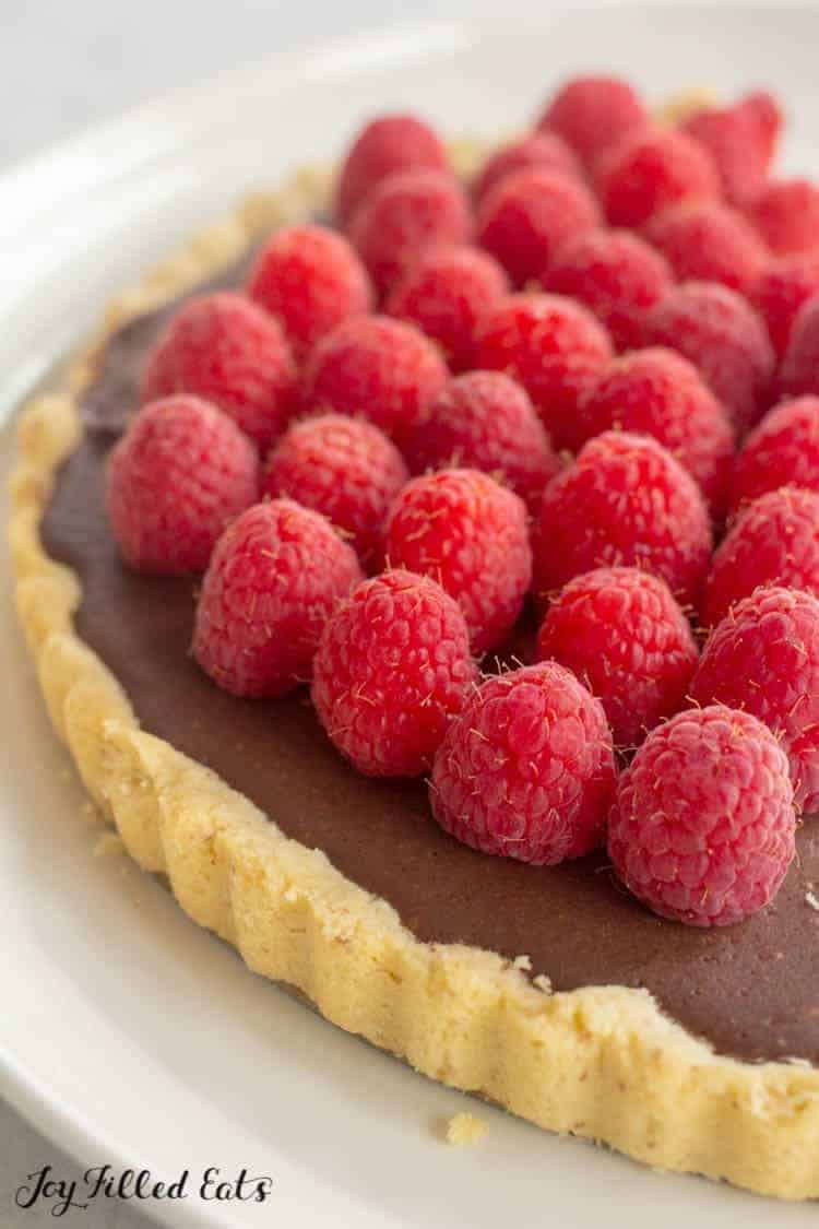 close up of the chocolate tart with raspberries
