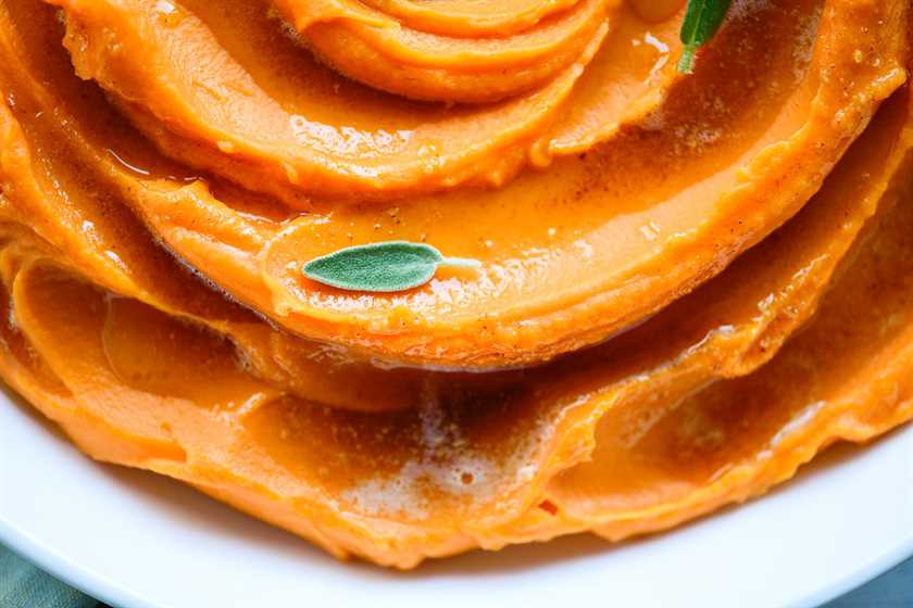 whipped sweet potatoes with a sage leaf