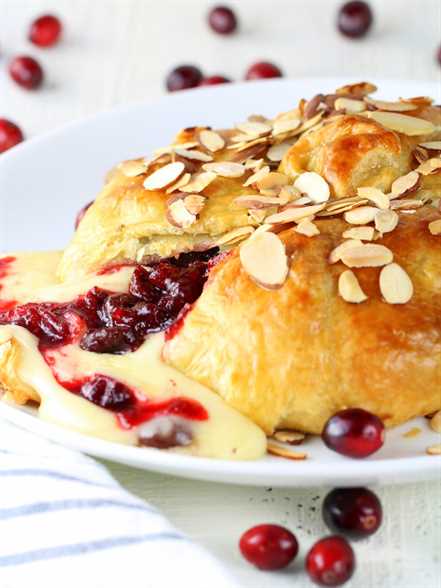 Baked Brie in puff pastry with cherry cranberry sauce