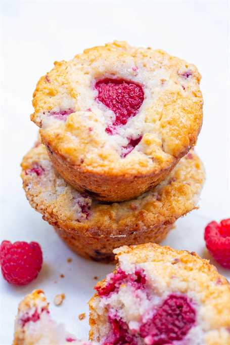Greek Yogurt Raspberry Muffins - EASY, soft, fluffy muffins bursting with fresh raspberries!! So moist thanks to Greek yogurt in the batter! Not overly sweet and perfect with a cup of coffee or tea!! 