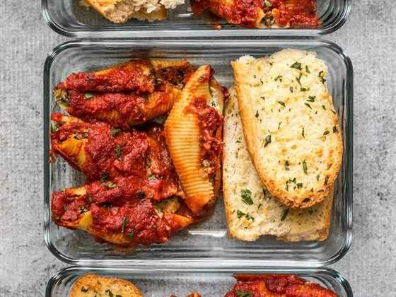 Pesto Stuffed Shells meal prep containers lined up