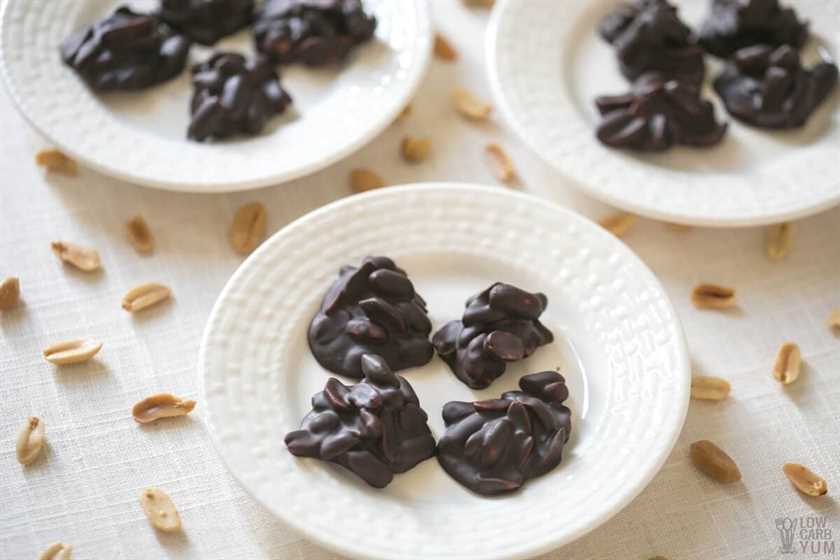 homemade chocolate peanut clusters on white plates