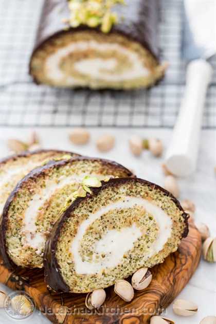 This moist poppyseed cake roll is generously filled with a cream cheese frosting, covered with velvety chocolate ganache and pummeled with salted pistachios. It’s moist, sweet, tangy, chocolaty and a teensy bit salty. We have a winner!