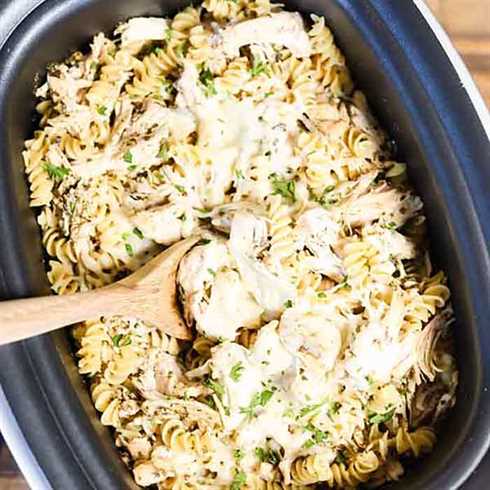 With very little prep work, Crock pot Pesto Chicken Pasta Casserole comes together quickly. Tender chicken, pesto and more combine for a flavorful meal.