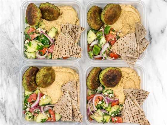 Four Falafel and Hummus Box Meal Prep containers side by side