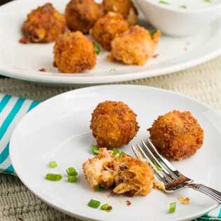 Fried Pimiento Cheese Balls on a plate with a platter in the background.