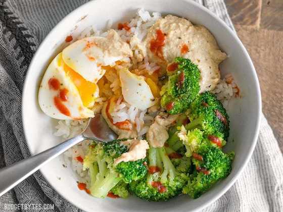 Overhead view of a Hummus Breakfast Bowl being eaten with a fork