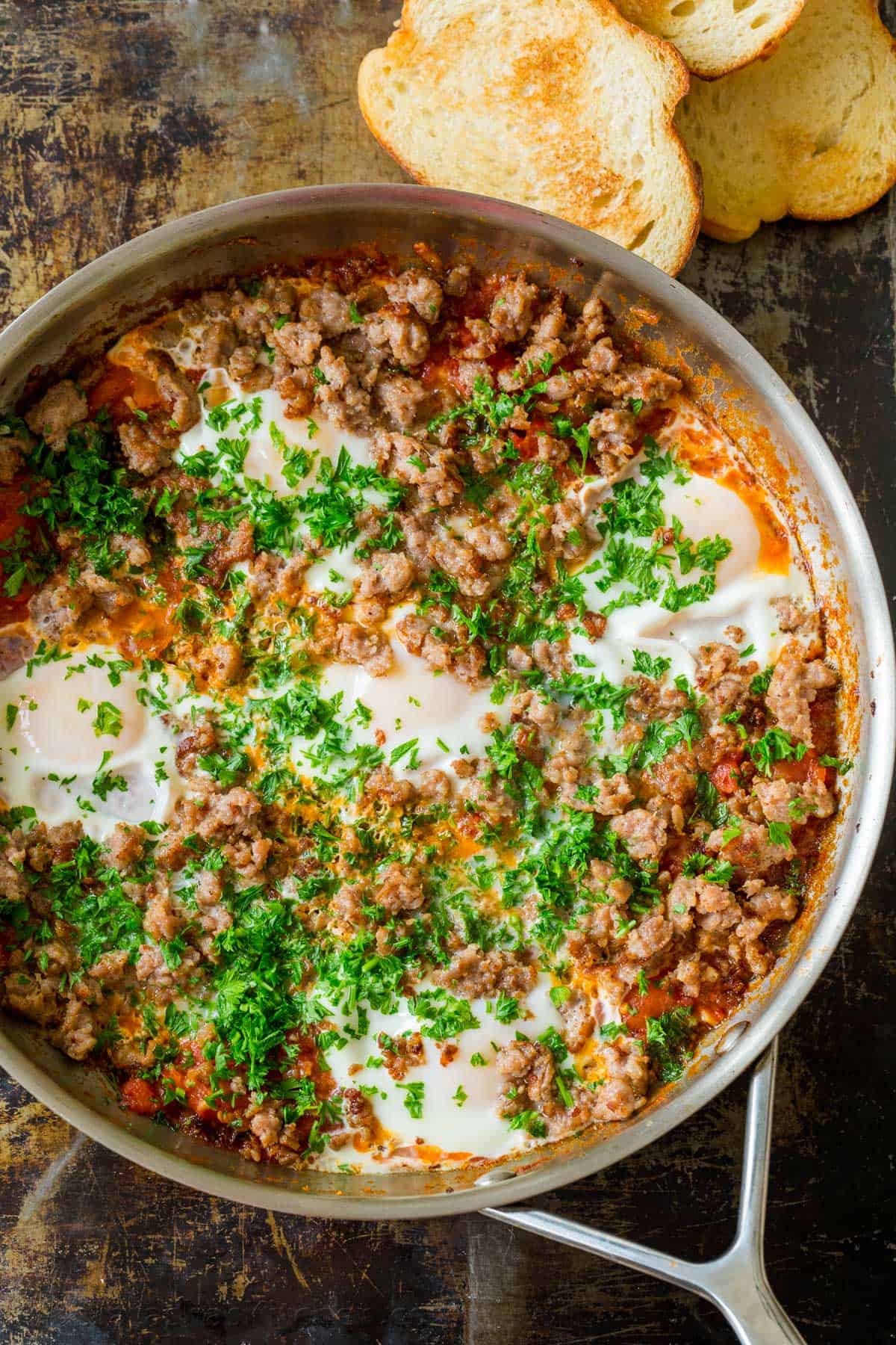 Shakshuka in skillet topped with parsley