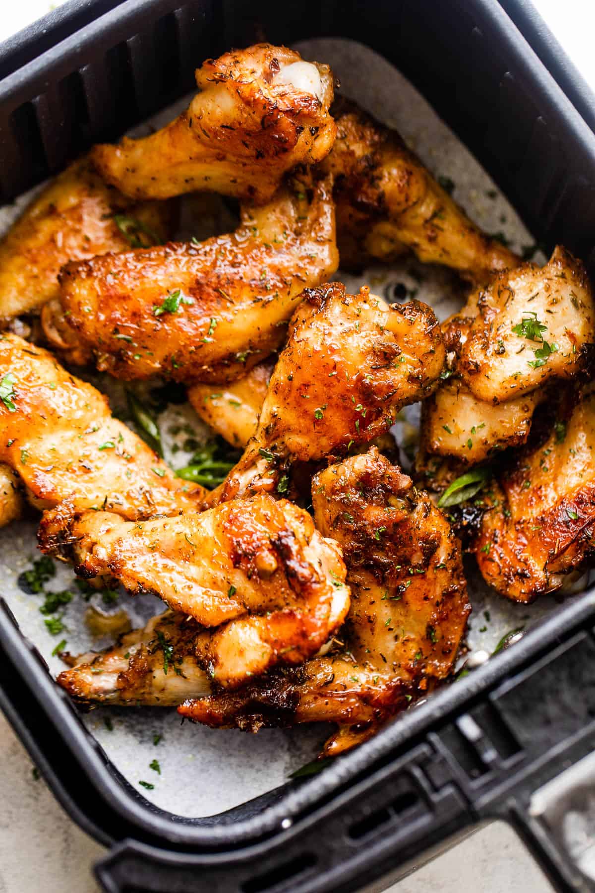cooked chicken wings in air fryer basket