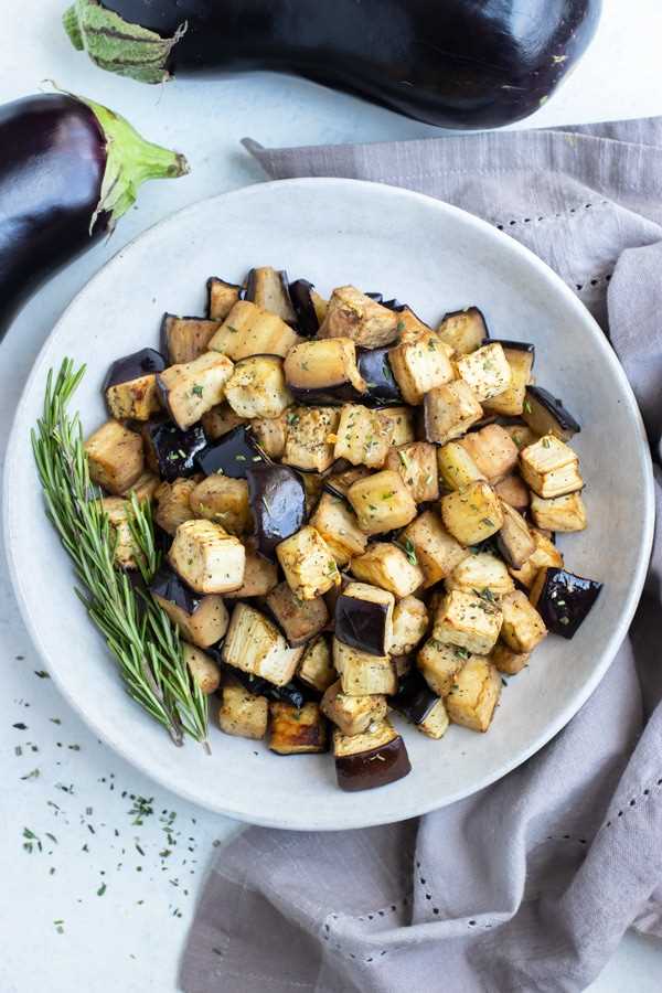A bowl of air fryer eggplant is shown for a healthy side dish.