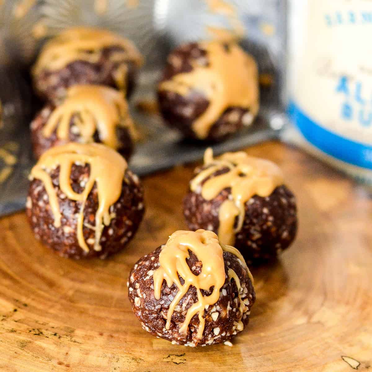 6 almond butter protein balls drizzled with almond butter