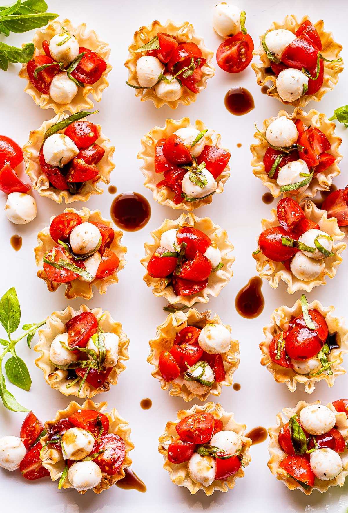 white plate with 15 Mini Caprese Cups on it.