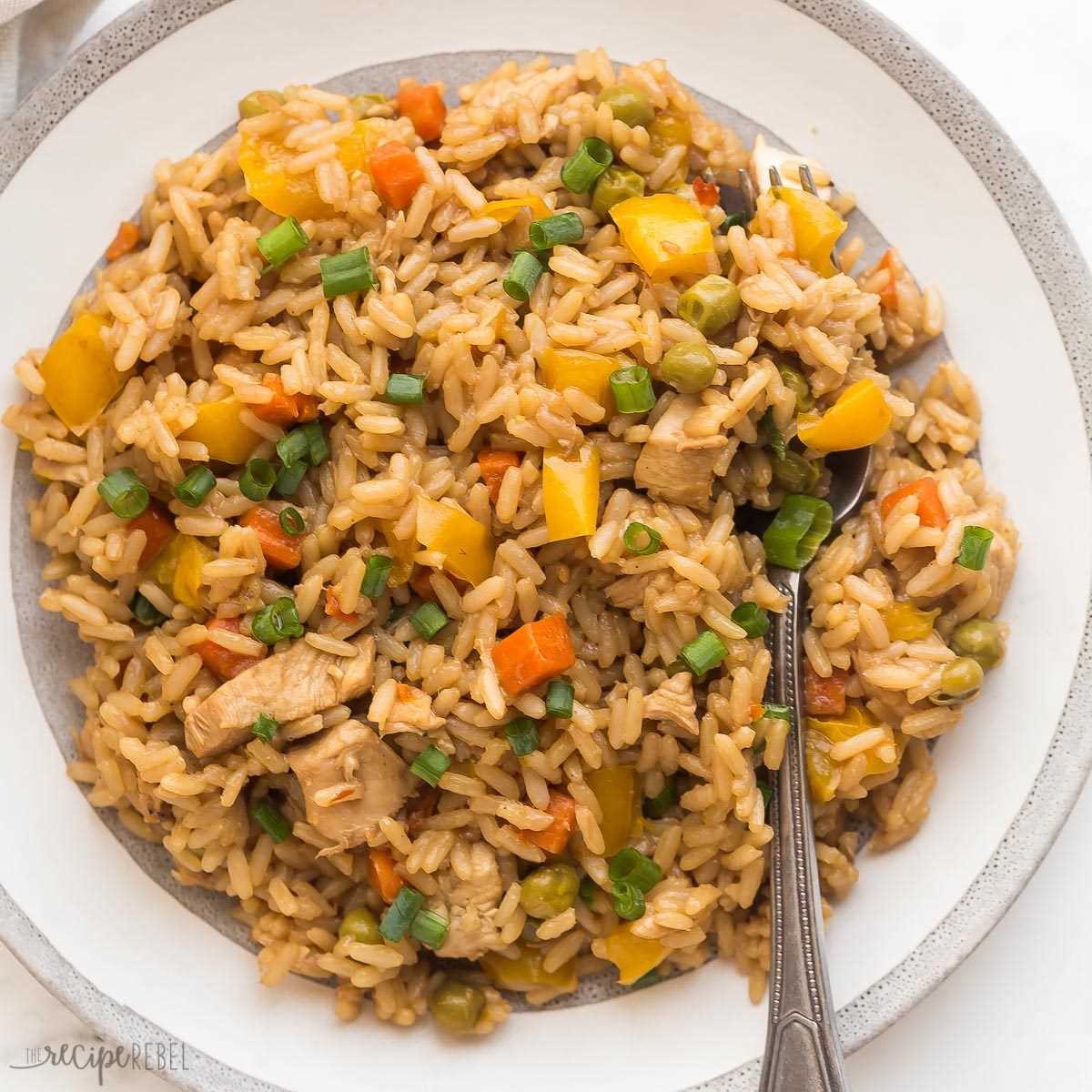 square image of instant pot teriyaki chicken and rice on white plate