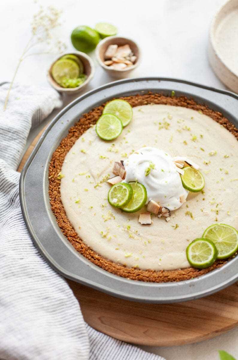Vegan Key Lime Pie topped with whipped cream and key lime slices