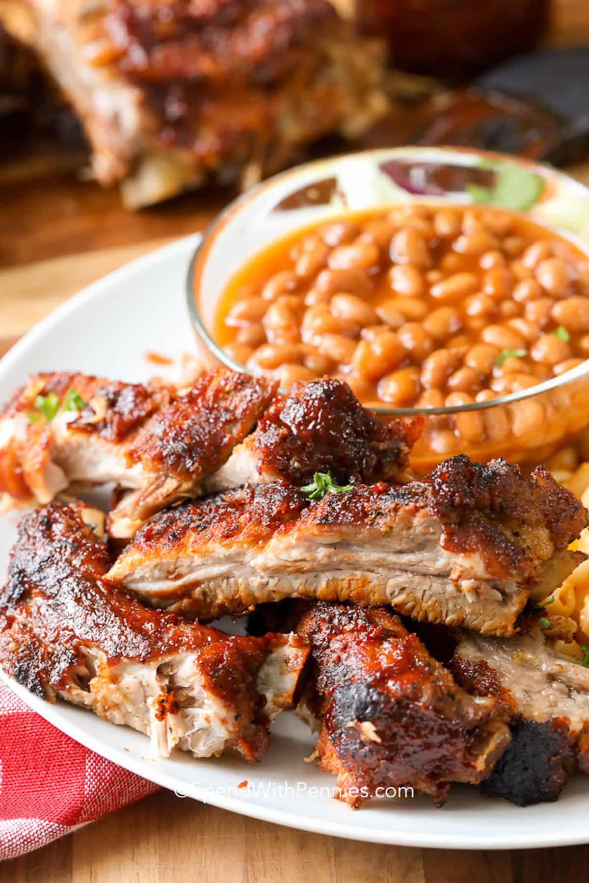 Barbecue Ribs served on a plate with baked beans