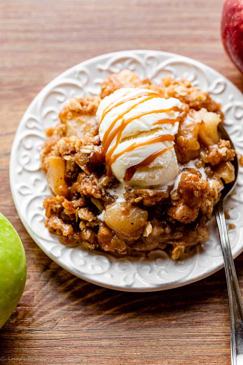 apple crisp serving with vanilla ice cream and caramel topping