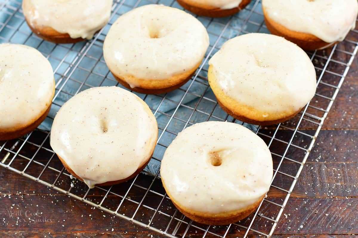 glazed doughnuts cooking on wire rack