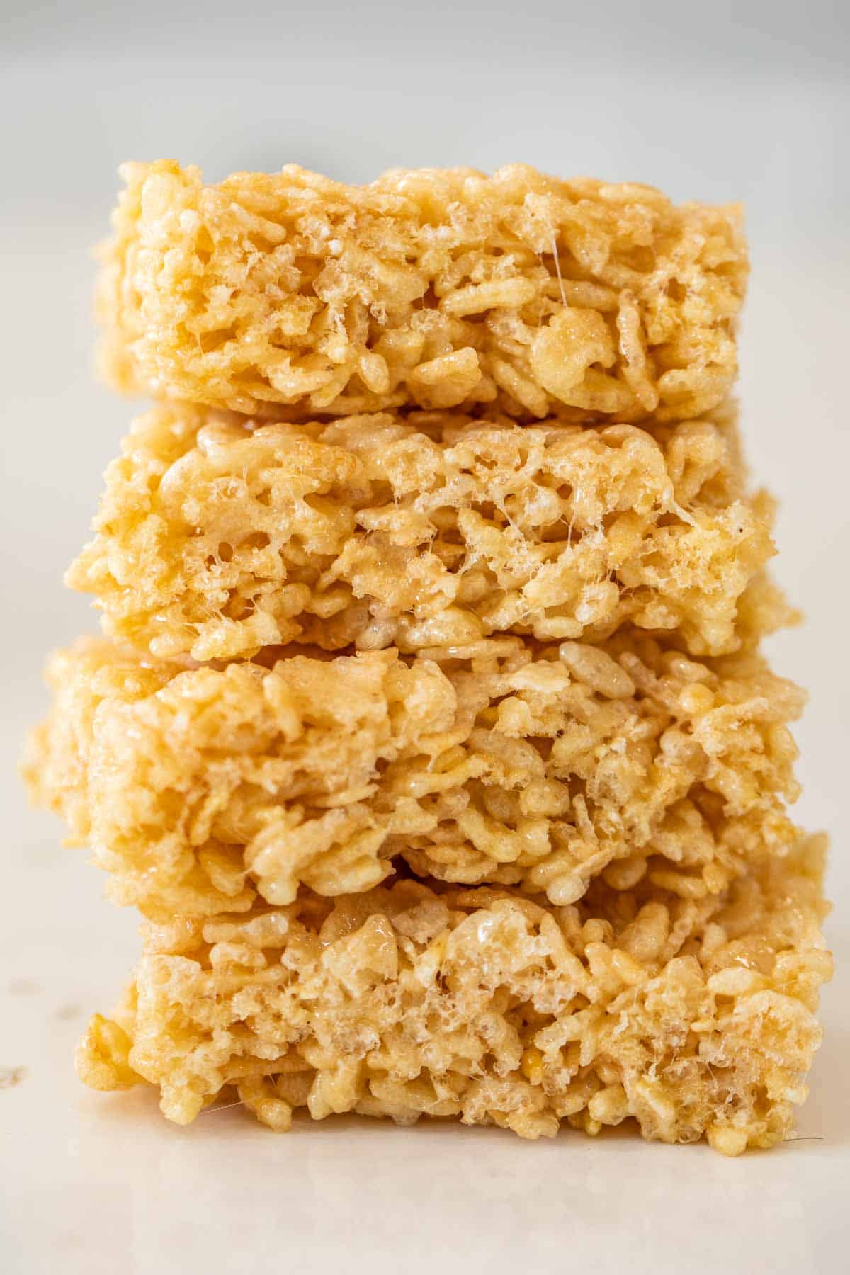 Rice krispie treat slices stacked on top of each other.