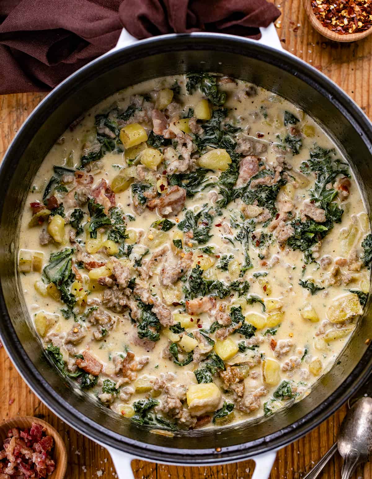 Zuppa Toscana Soup in a Pot on a Cutting Board